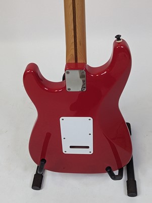 Lot 521 - A Squier by Fender stratocaster electric...