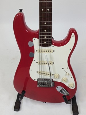 Lot 521 - A Squier by Fender stratocaster electric...