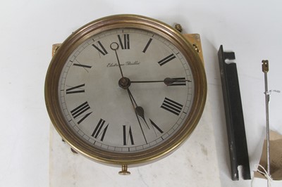 Lot 137 - A Brillie electric wall clock, having a...