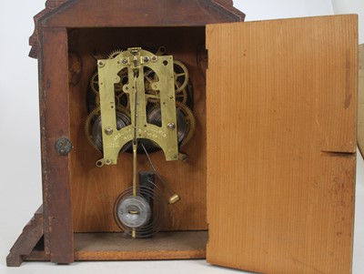 Lot 147 - An American faded mahogany cased mantel clock,...