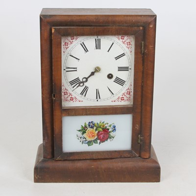 Lot 147 - An American faded mahogany cased mantel clock,...