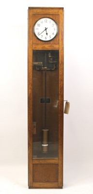 Lot 395 - A Magneta oak cased electric Master clock,...