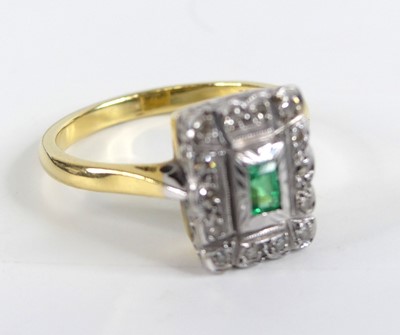 Lot 1305 - A yellow and white metal, emerald and diamond...