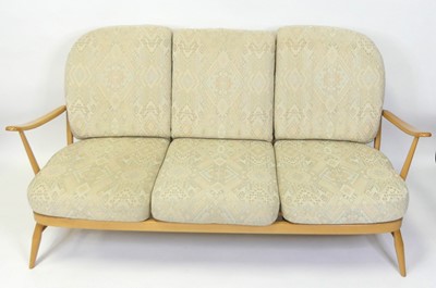 Lot 1391 - An Ercol blond beech stickback three-seater...