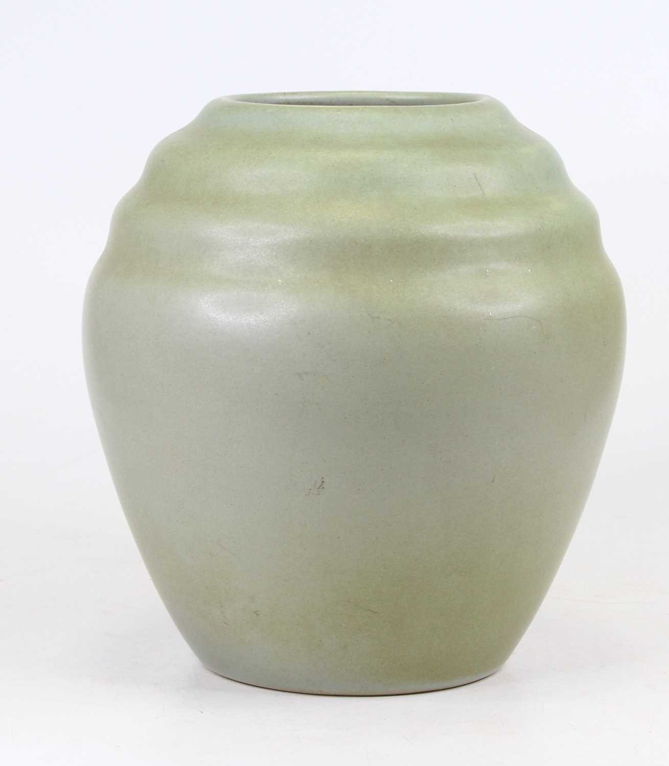 Lot 9 - A pale green glazed stoneware vase, of ovoid...