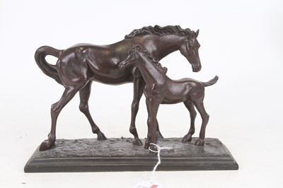 Lot 31 - A bronzed resin group of a horse and foal, h.18cm