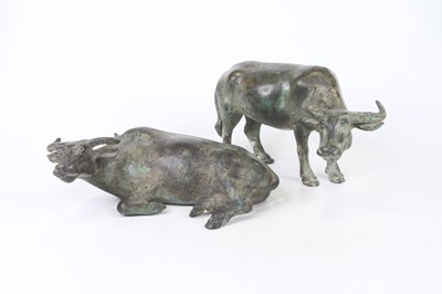 Lot 38 - Two verdigris metal models of oxen, the...