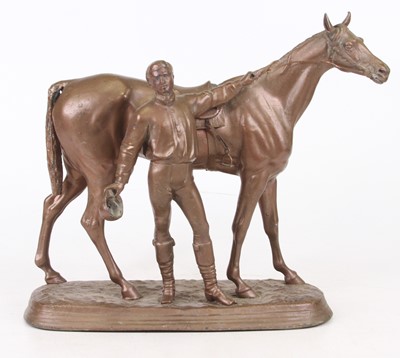 Lot 44 - A gilt spelter model of a horse and jockey,...
