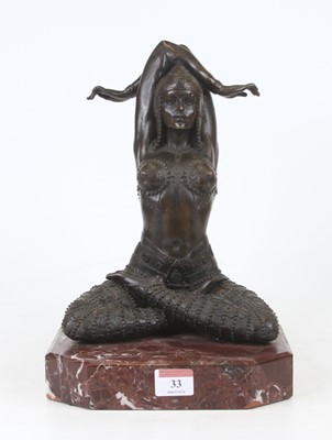 Lot 33 - A bronzed figure of a lady, shown in yoga pose,...