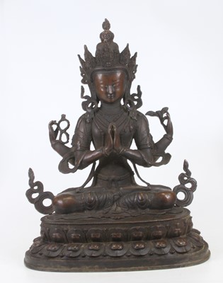 Lot 47 - A bronzed metal figure of Tara, shown seated,...