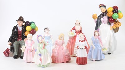 Lot 55 - A collection of nine Royal Doulton figures to...