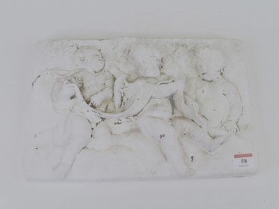 Lot 58 - A plaster relief plaque, decorated with putti,...