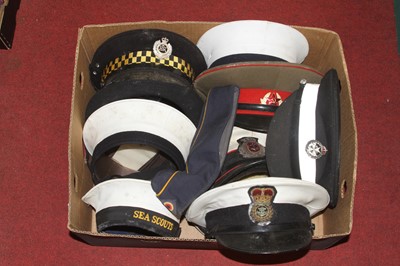 Lot 85 - A collection of military, naval and police caps