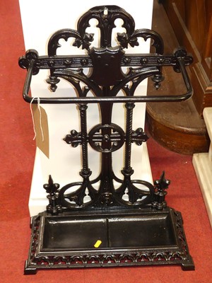 Lot 1116 - A black painted cast iron pierced stick stand,...