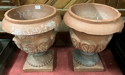 Lot 1120 - A pair of small terracotta footed circular...