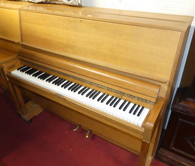 Lot 1131 - A hardwood cased upright piano by Danemann,...