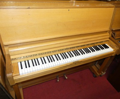 Lot 1133 - A hardwood cased upright piano by Danemann,...