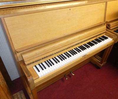 Lot 1135 - A hardwood cased upright piano by Danemann,...