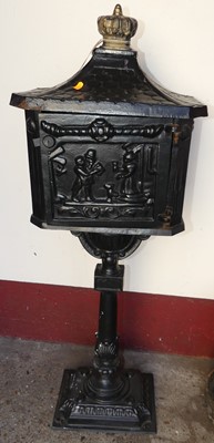 Lot 1187 - A black painted cast iron freestanding...