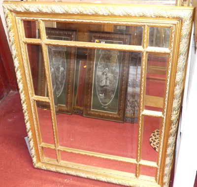 Lot 1088 - A modern gilt framed sectional wall mirror,...