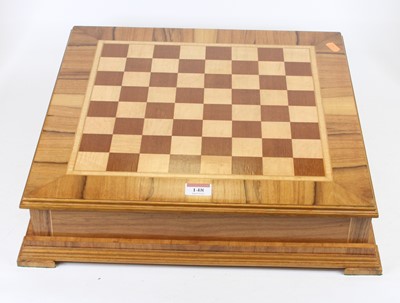 Lot 148 - A walnut and maple veneered chessboard, the...