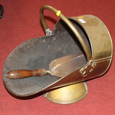 Lot 162 - A Victorian helmet shaped copper coal scuttle,...