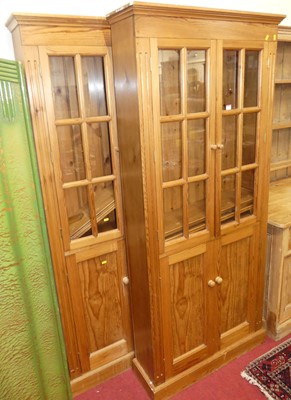 Lot 1174 - A pair of contemporary pine bookcases, each...