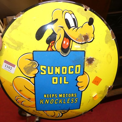 Lot 1102 - A convex enamel advertising sign for Sunoco...