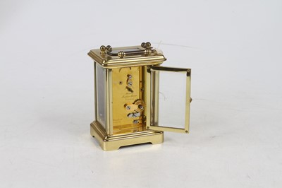 Lot 174 - A 20th century lacquered brass carriage clock,...