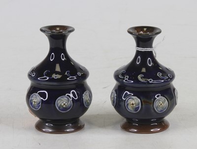 Lot 199 - A pair of Royal Doulton miniature stoneware...