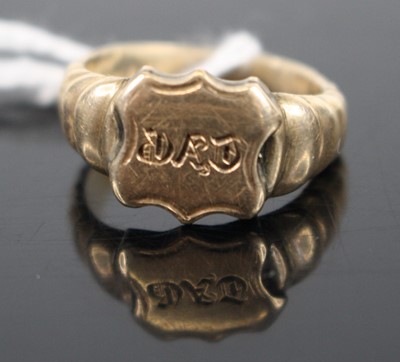 Lot 290 - A yellow metal signet ring annotated 'Dad',...