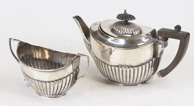 Lot 209 - A George V silver bachelor's teapot of reeded...