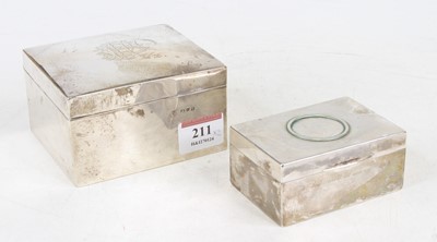 Lot 211 - A George VI silver clad table cigarette box of...