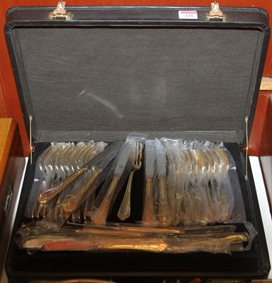 Lot 225 - An SBS Bestecke gold plated canteen of cutlery,...