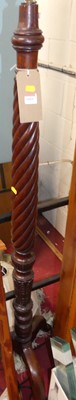 Lot 1184 - A mahogany floral carved and spiral reeded...