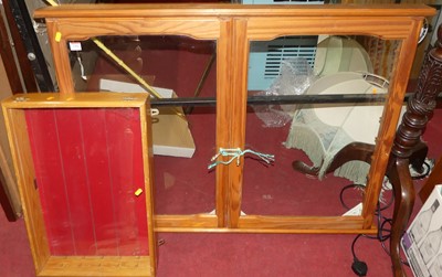 Lot 1186 - A pine wall mounted double door glazed...