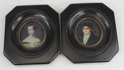 Lot 405 - A pair of reproduction portrait miniature...