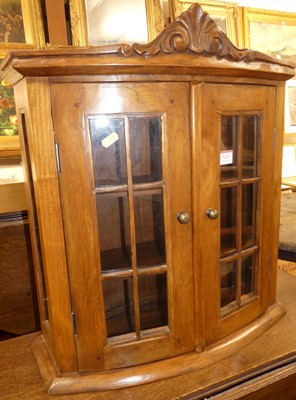 Lot 1211 - A contemporary hardwood bowfront double door...