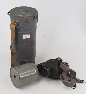 Lot 427 - A WWII FATRA full face gas mask, housed in tin...