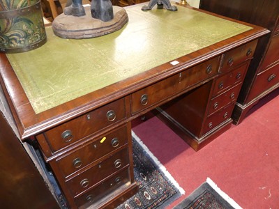 Lot 1233 - An early 20th century mahogany and gilt tooled...