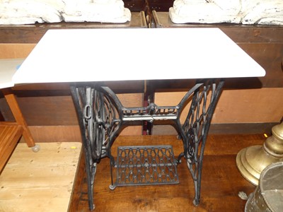 Lot 1249 - An early 20th century Singer cast iron sewing...