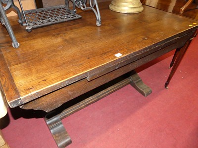 Lot 1251 - An oak rectangular dining table, raised on...