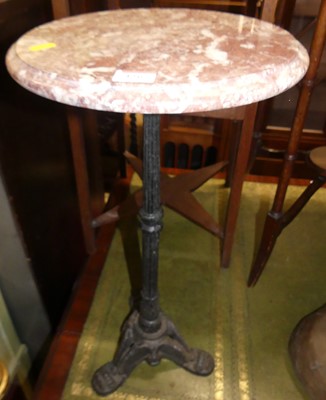 Lot 1265 - A rouge marble circular topped and cast iron...