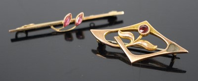 Lot 303 - A vintage 9ct gold garnet set openwork brooch...