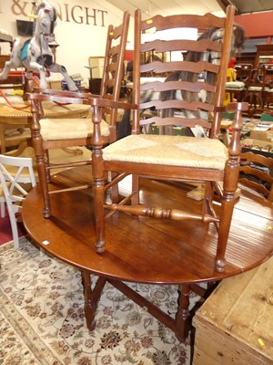 Lot 1273 - A contemporary walnut dropleaf dining table,...