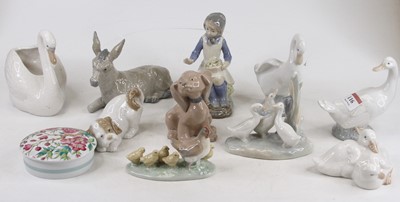 Lot 116 - A collection of ten Nao porcelain figures, the...