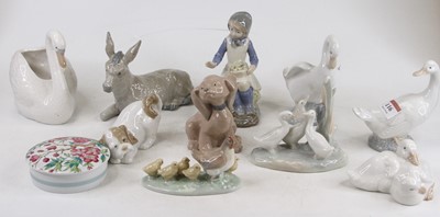 Lot 116 - A collection of ten Nao porcelain figures, the...