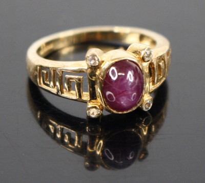 Lot 315 - A 9ct gold star sapphire and cz set dress ring...