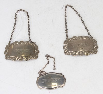 Lot 240 - A pair of silver and embossed decanter collars...