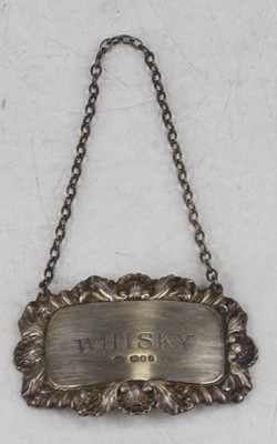 Lot 253 - A silver and embossed decanter collar...